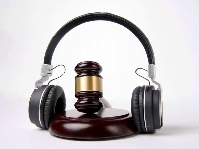 Best Music Licensing Companies for Independent Artists headphones and a hammer - Best Music Licensing Companies